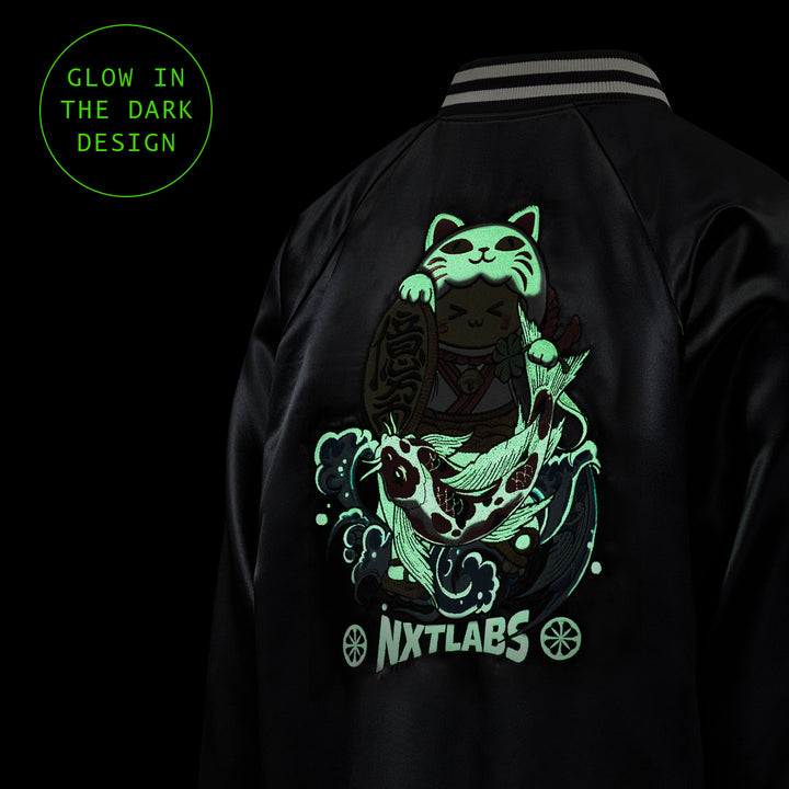 Black jacket with a glowing green design of a cat and fish, labeled 'Nxtlabs', on a dark background.