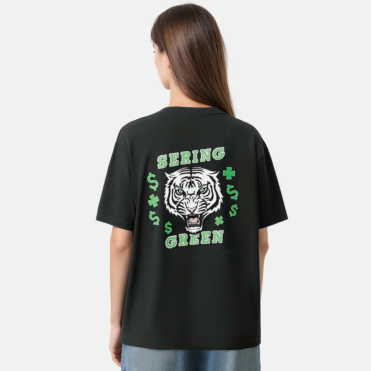 Person wearing a black t-shirt with a tiger graphic and text on the back