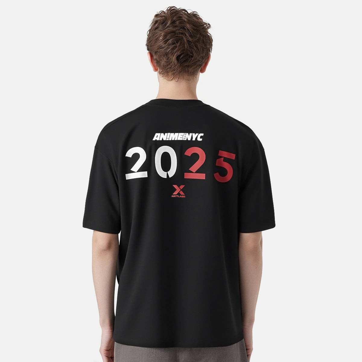 Person wearing a black t-shirt with 'ANIME NYC 2025' text on the back against a white background