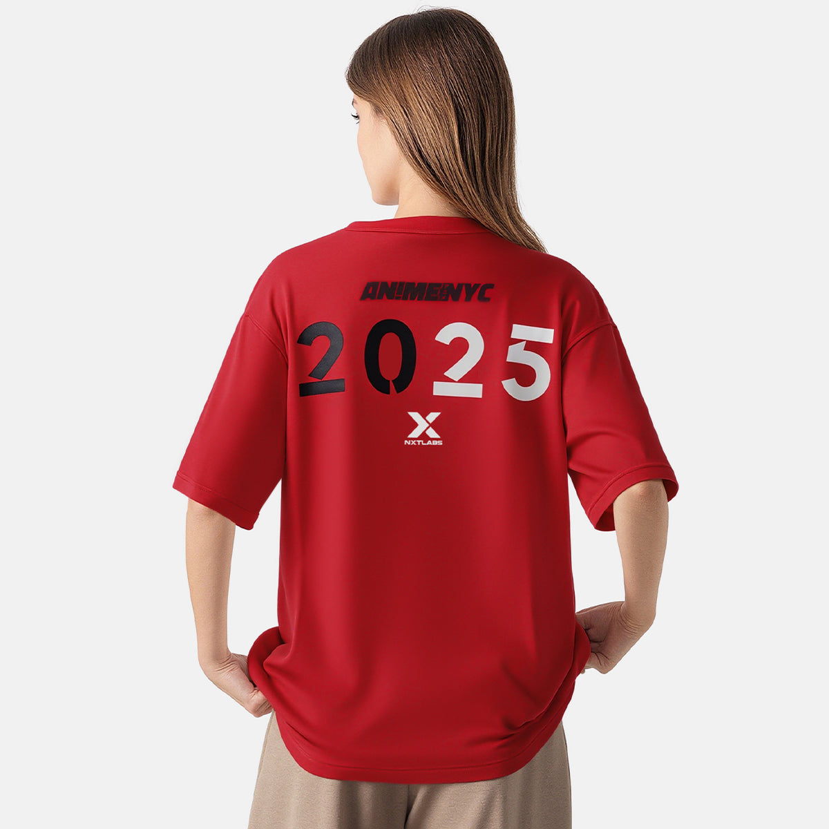 Person wearing a red t-shirt with '2025' printed on the back against a white background