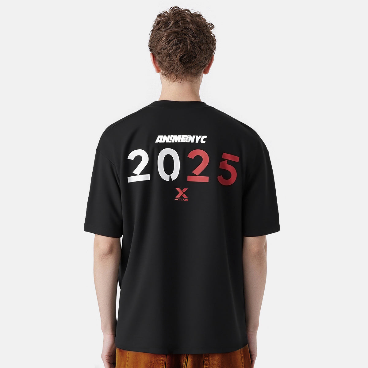 Person wearing a black t-shirt with 'ANIME NYC 2025' text on the back against a white background
