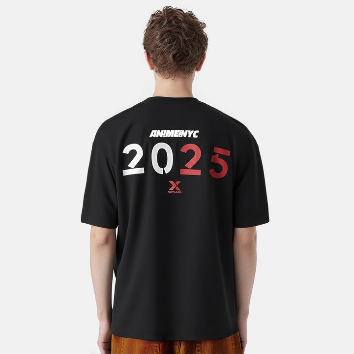 Person wearing a black t-shirt with 'ANIME NYC 2025' text on the back against a white background