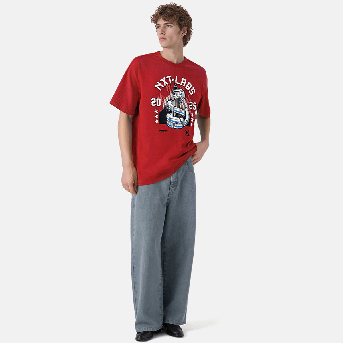 Person wearing a red t-shirt with graphic design on a white background