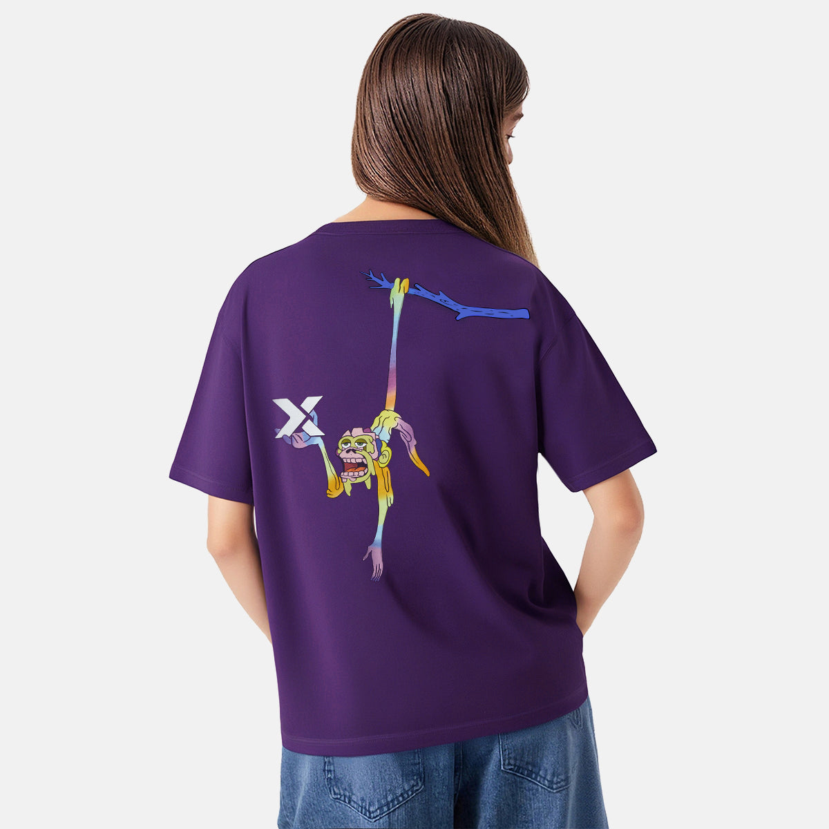 Person wearing a purple t-shirt with a colorful graphic on the back, standing against a white background