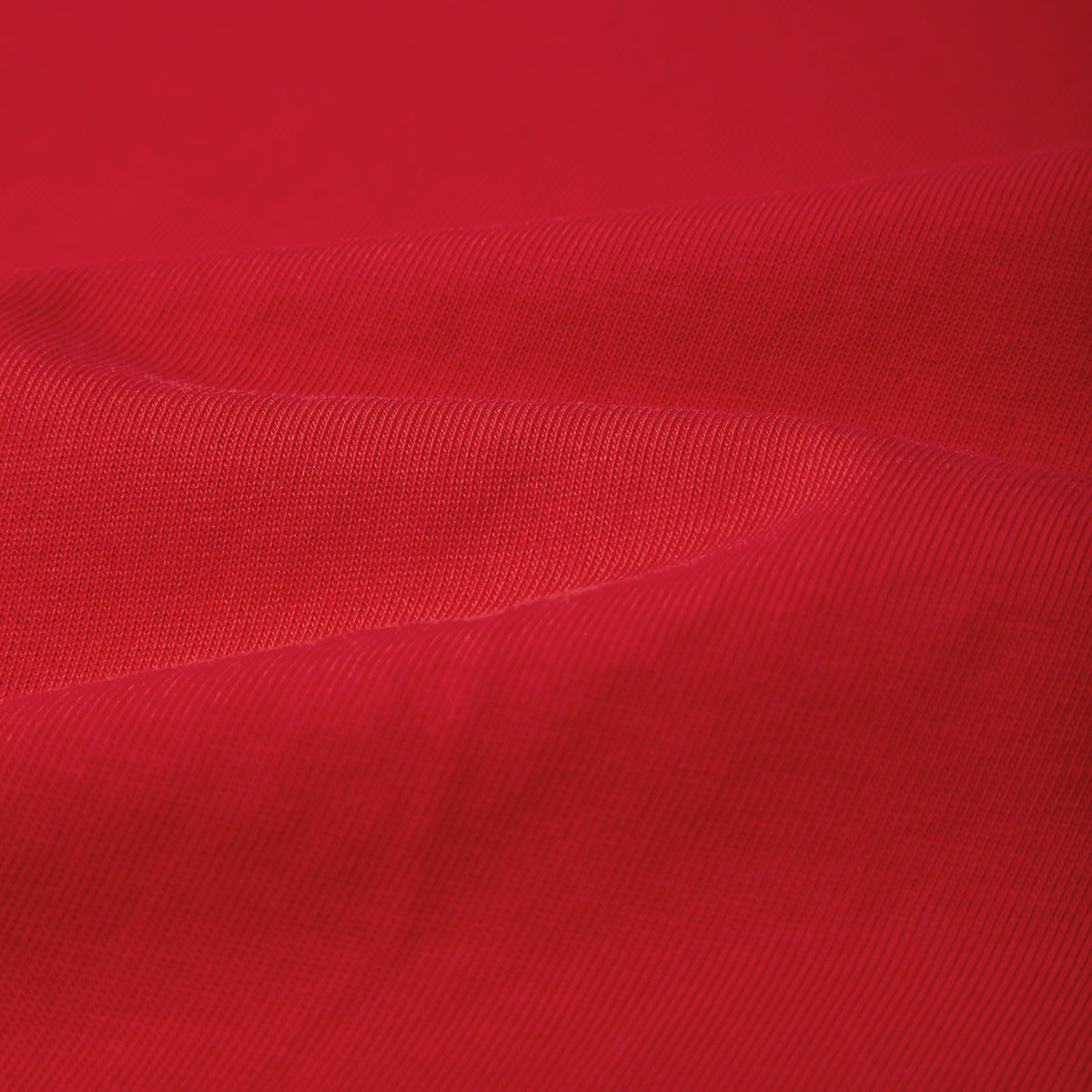 Close-up of red fabric with a textured pattern