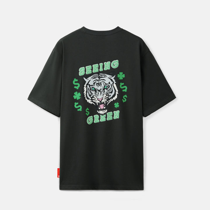 Black t-shirt with a tiger graphic and 'Seeing Green' text on the back, displayed against a light gray background.