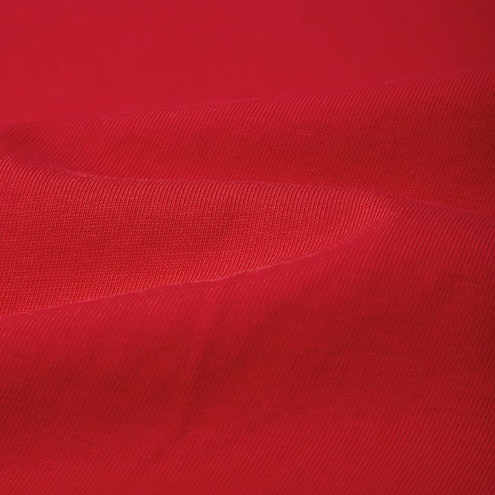 Close-up of red fabric with a textured pattern
