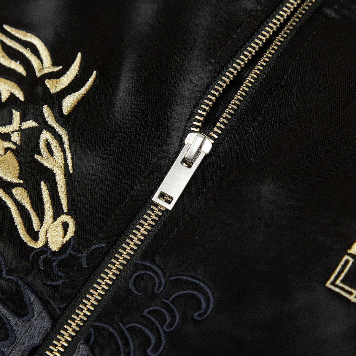 Black jacket with gold and white embroidery and zipper