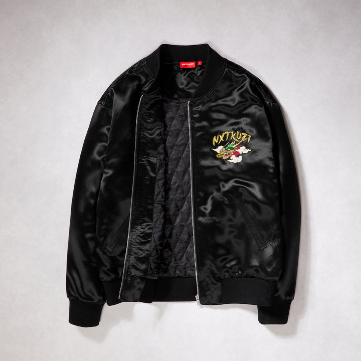 Black bomber jacket with embroidered logo on a light gray background